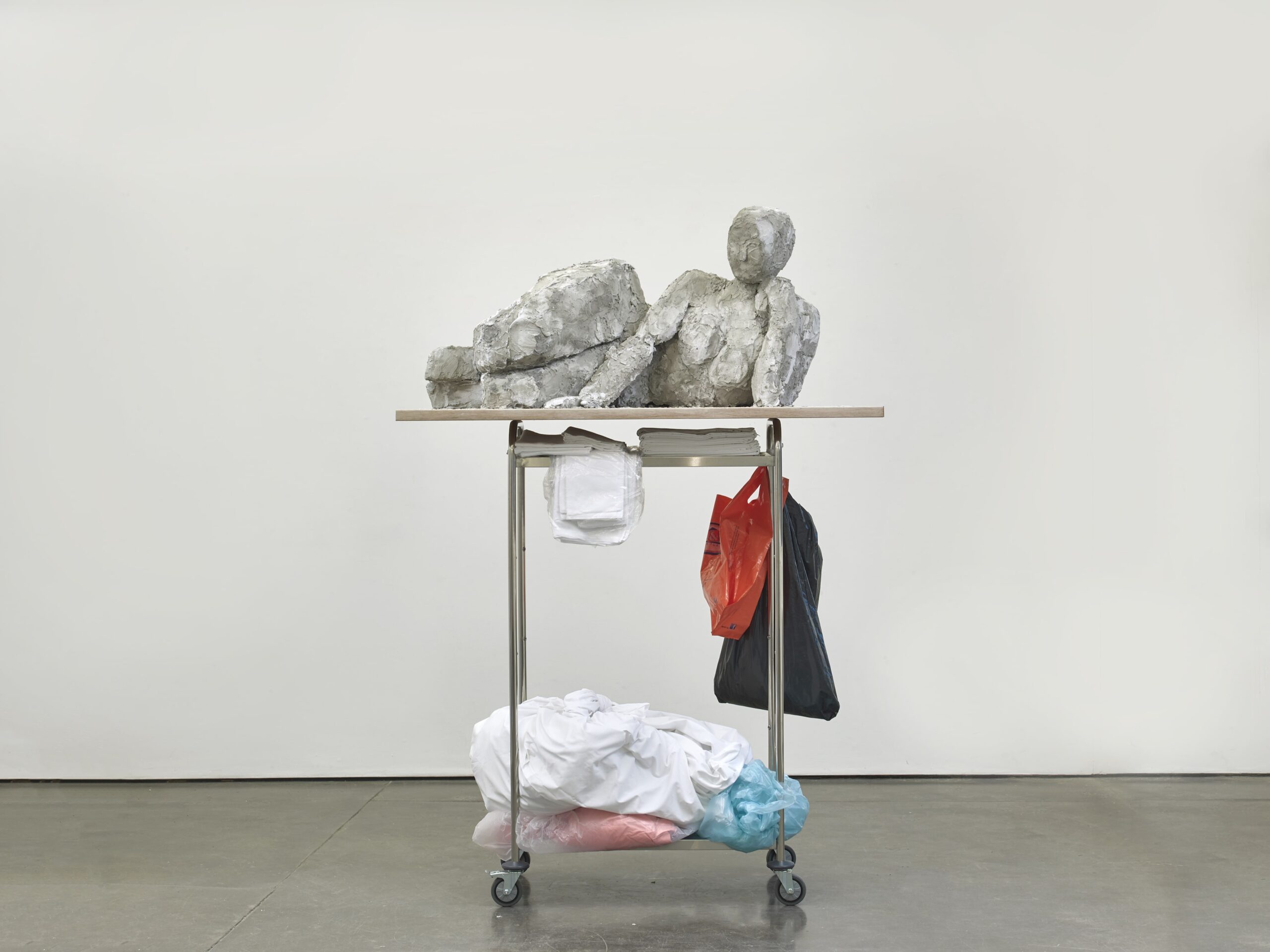 Reclining Female #3 2022 Plaster, pigment, styrofoam, fabric, metal, wood, housekeeping trolley, various materials 221 x 176 x 76 cm / 87 x 69.3 x 29.9 in