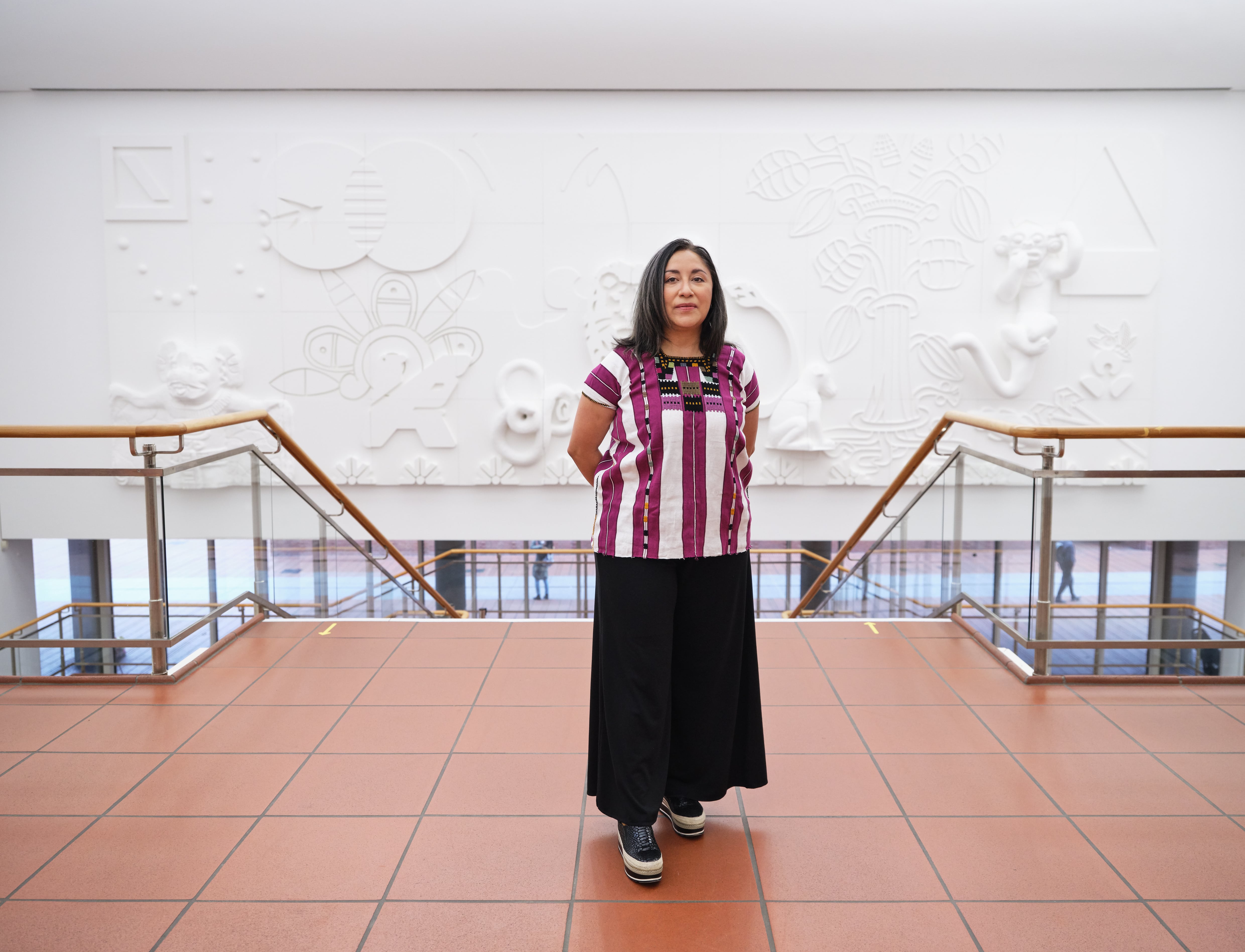 Minerva Cuevas in front of her work 'The Enterprise', 2021. Styrofoam, MDF, wall paint. Copyright: the artist, photo: Rheinisches Bildarchiv Köln/Marc Weber